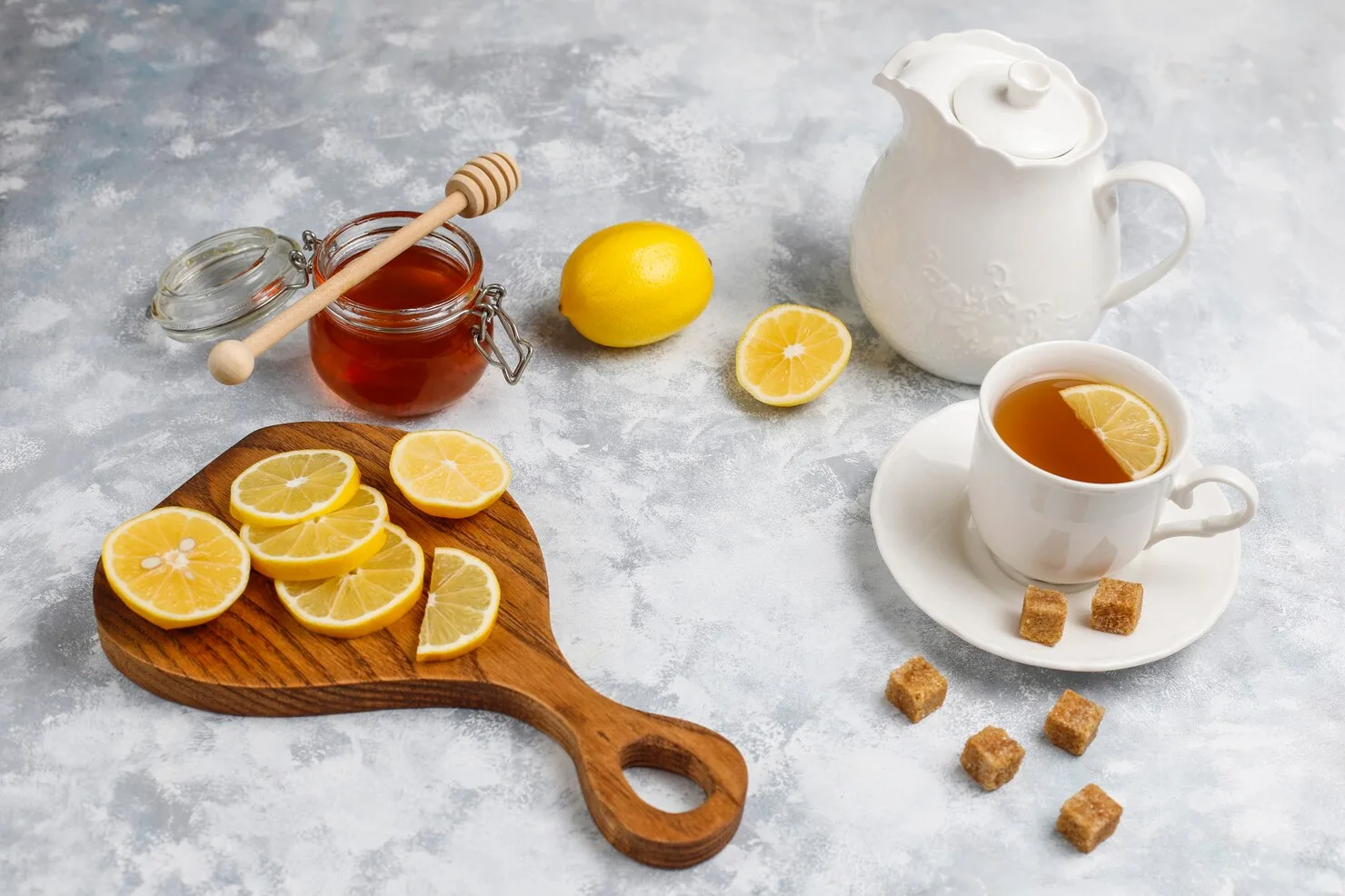 cup-tea-brown-sugar-honey-lemon-concrete-top-view-copy-space_114579-4102